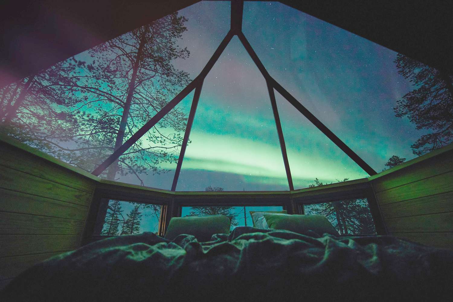 Glass igloos under the northern lights